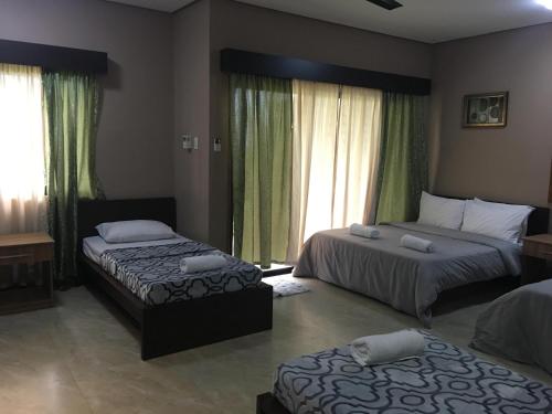 Katil atau katil-katil dalam bilik di Secter Place