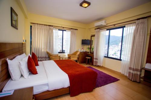 Cama o camas de una habitación en Hotel Tara