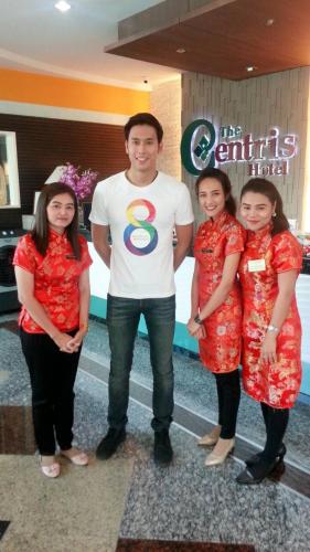 a man and three women standing in front of a store at The Centris Hotel Phatthalung in Phatthalung