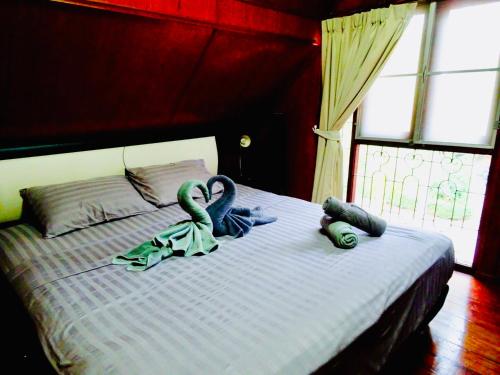 En eller flere senge i et værelse på Starbay Samui