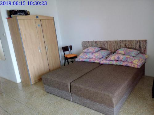 Posteľ alebo postele v izbe v ubytovaní Vízparti apartmanok