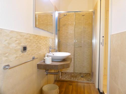 a bathroom with a sink and a shower at Il Fiore di Monnalisa in Vinci