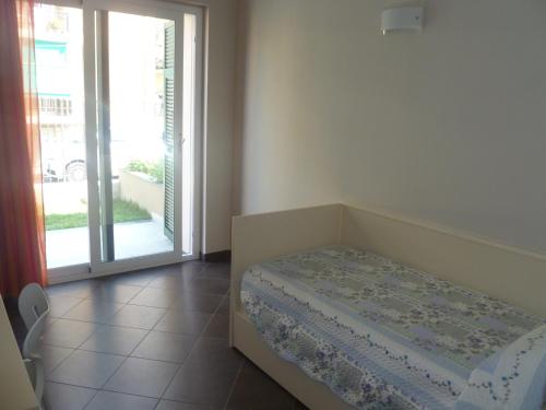 Postel nebo postele na pokoji v ubytování Le Vele Residence