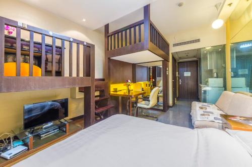 Ένα ή περισσότερα κρεβάτια σε δωμάτιο στο Shanghai Jiarong Hotel Apartment