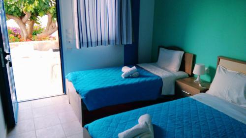 Llit o llits en una habitació de Psathi Beach