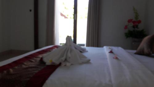 Ένα ή περισσότερα κρεβάτια σε δωμάτιο στο PITAMATA VILLAS