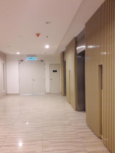an empty hallway of an office building with doors and floors at BS Homestay2 - 1 Bedroom Apartment in Miri Times Square in Miri