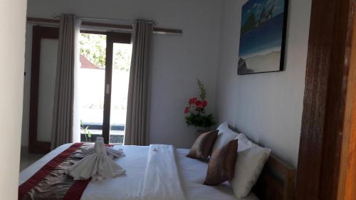 Ένα ή περισσότερα κρεβάτια σε δωμάτιο στο PITAMATA VILLAS