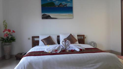 Ένα ή περισσότερα κρεβάτια σε δωμάτιο στο PITAMATA VILLAS