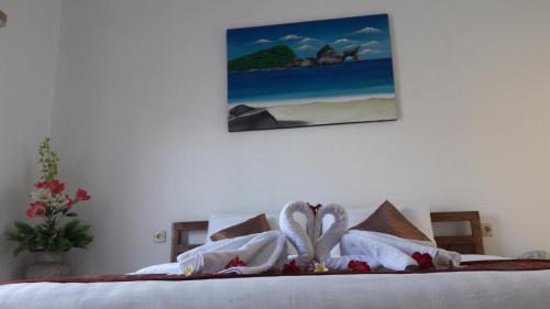 Postel nebo postele na pokoji v ubytování PITAMATA VILLAS