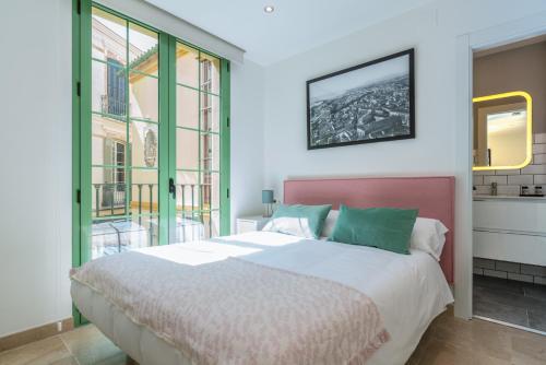 Posteľ alebo postele v izbe v ubytovaní Apartamentos Miraflores