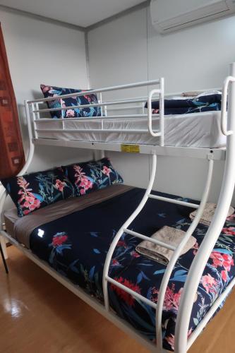 a couple of bunk beds in a room at Mud Crab Motel in Derby