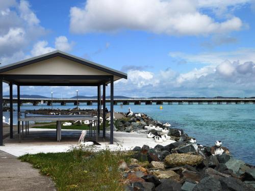 a pavilion on the shore of a body of water at 11 Peel Street in Tuncurry