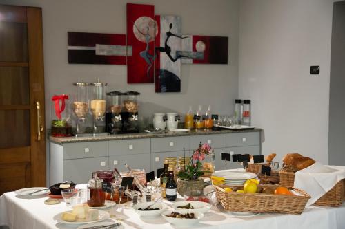 a table with baskets of food on top of it at Hotel Giardino in Cannobio