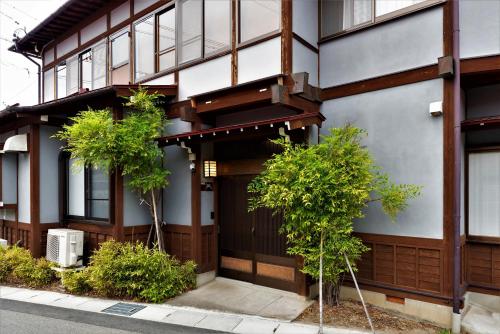 a building with trees in front of it at Hida-Takayama Michi in Takayama