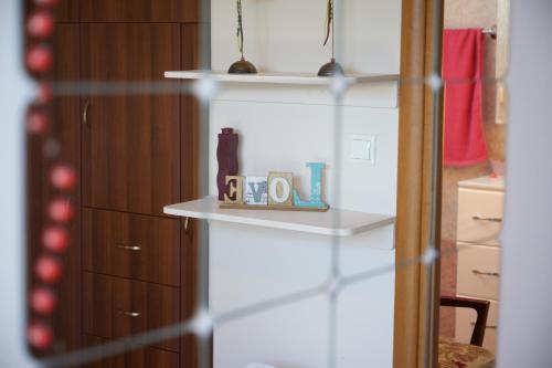 a shelf with two mugs on it in a room at Christina's place in Sami