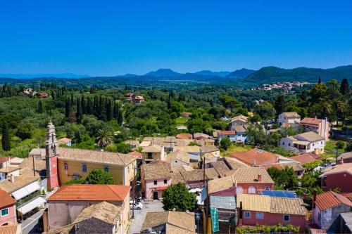an aerial view of a small town with houses at Amelia & Nicholas Stone Houses in Doukádes