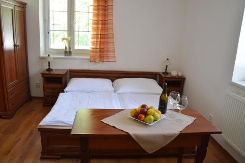 Apartmány Divoký Andělにあるベッド