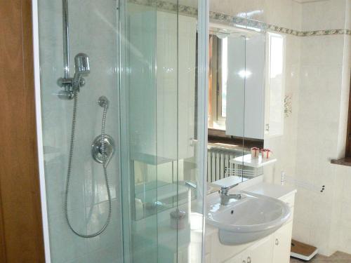 a bathroom with a shower and a sink at Villa Elma in Cigliè