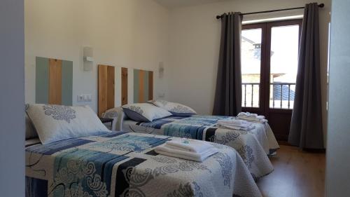 A bed or beds in a room at La Posada del Druida