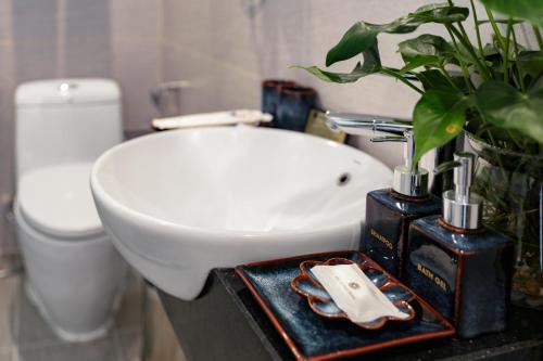 a bathroom with a sink and a toilet at Hanoi Backpackers Hostel & Rooftop bar in Hanoi