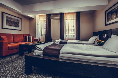 Ένα ή περισσότερα κρεβάτια σε δωμάτιο στο Hotel Cherica