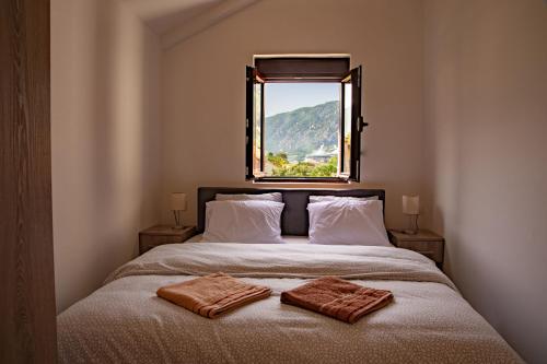 מיטה או מיטות בחדר ב-Rooms & Apartments Vukasović