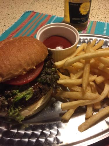 a plate with a hamburger and french fries and ketchup at Heart Hostel and Diner 女性専用Onlyfemale in Ise