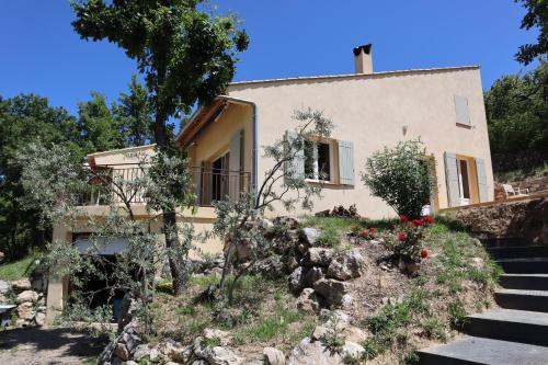 a house with stairs leading up to it at Maison Couquets Bauduen in Bauduen