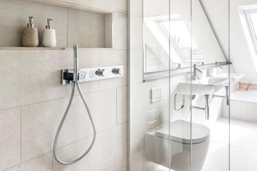 a bathroom with a shower and a sink at The Loft : Luxury Countryside Retreat for Family & Friends in Clipston