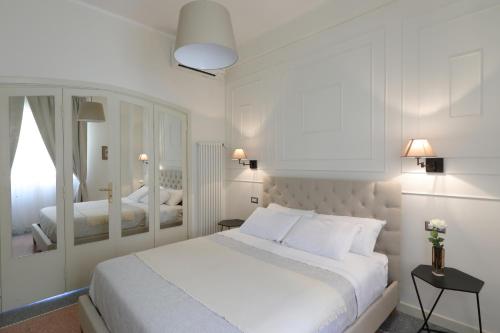 Postel nebo postele na pokoji v ubytování B&B Dimora del Duomo
