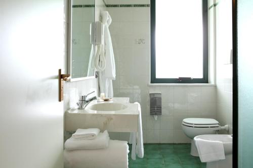 Koupelna v ubytování Hotel Romanisio
