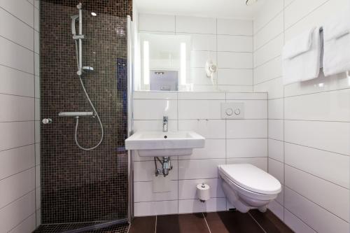 Ett badrum på Thon Partner Hotel Victoria Hamar
