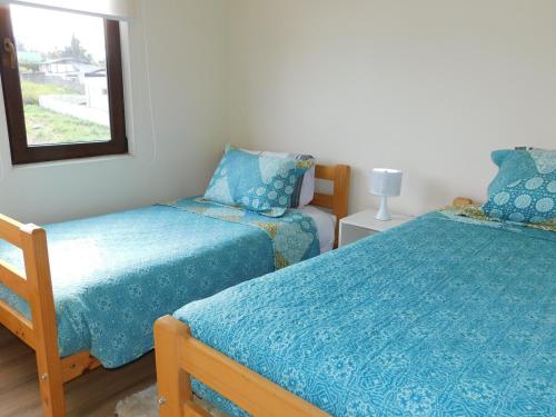 Una cama o camas en una habitación de Los Magnolios