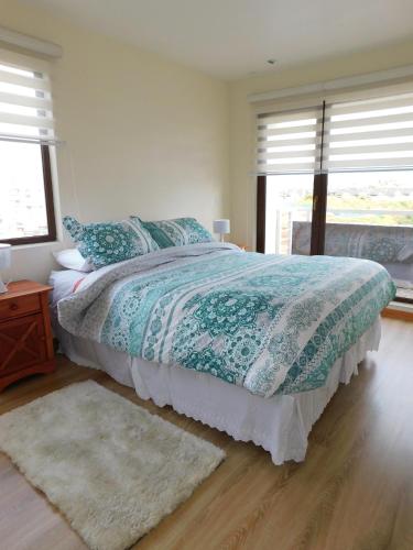 Una cama o camas en una habitación de Los Magnolios