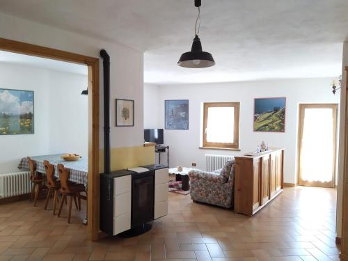 a living room with a couch and a table at Casa Vacanze Fontana in Coredo