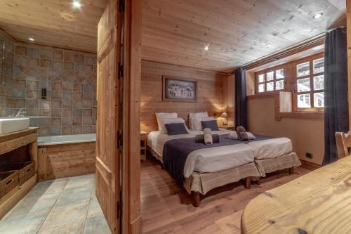 Ένα ή περισσότερα κρεβάτια σε δωμάτιο στο Chalet les trois coeurs