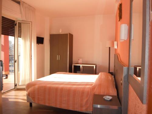 Postel nebo postele na pokoji v ubytování Hotel Renato