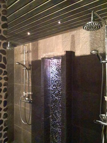 a bathroom with a shower with a shower at Eräjärven Eerola Guesthouse in Eräjärvi