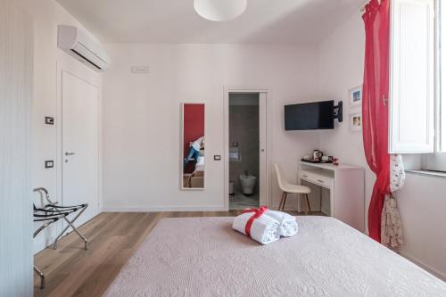 Ένα ή περισσότερα κρεβάτια σε δωμάτιο στο B&B Terza Luna