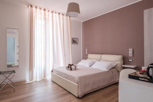 Ένα ή περισσότερα κρεβάτια σε δωμάτιο στο B&B Terza Luna