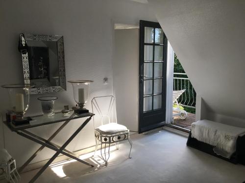 a room with a table and a chair and a window at Einfamilienhaus im Landhausstil in Meerbusch