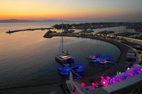 a boat is docked in a harbor at sunset at Boutique Apartments Ad Astra in Bibinje