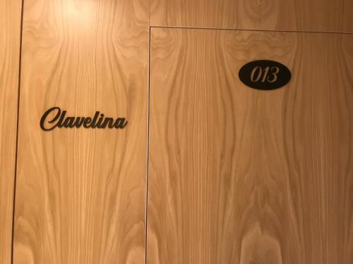 a wooden door with the word camelia on it at A Casa da Botica in Samos