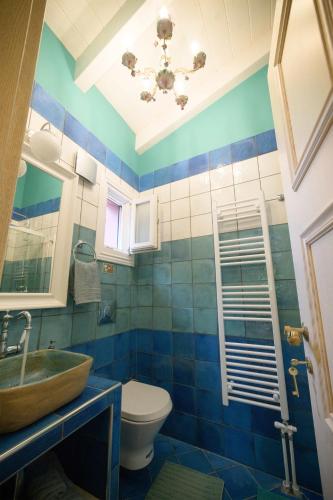 a bathroom with a sink and a toilet at Villa Nitsa in Corfu Town