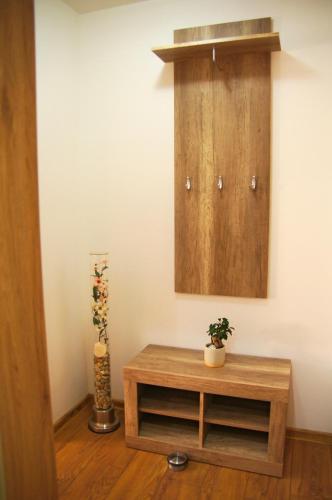 a room with a wooden table and a cabinet at Vila Harmónia in Turčianske Teplice