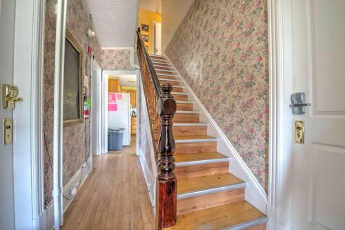 a staircase in a home with wooden floors and a hallway at HI Charlottetown Backpacker's Inn in Charlottetown