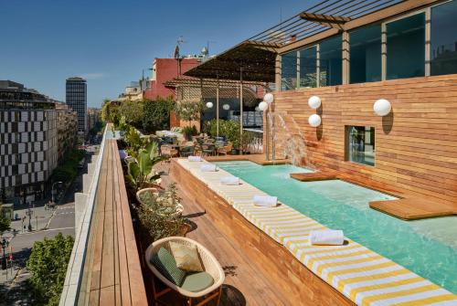 a swimming pool on the roof of a building at Sir Victor Hotel in Barcelona