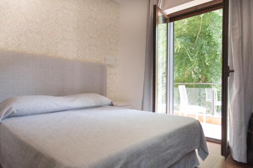 Postel nebo postele na pokoji v ubytování B&B Maria Rosaria