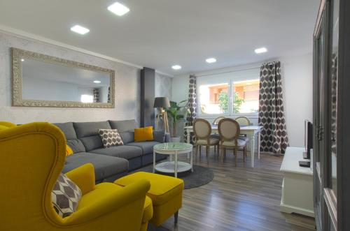 a living room with a couch and a table at Apartment Ronda Sant Antoni in Girona
